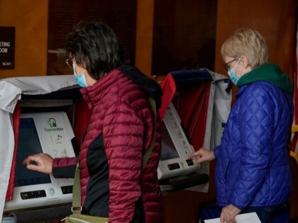 Residents cast their votes at the Warner Park Community Recreation Center on the first day of early voting Tuesday, March 21, 2023, in Madison, Wis. Wisconsin voters began casting ballots in person in the state's high-stakes Supreme Court race, hours before the two candidates were slated to meet for their …