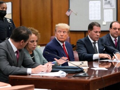 NEW YORK, NEW YORK - APRIL 04: Former U.S. President Donald Trump sits with his attorneys inside the courtroom for his arraignment proceeding at the Manhattan criminal court April 4, 2023 in New York City. Former U.S. President Donald Trump pleaded not guilty to 34 felony counts stemming from hush …