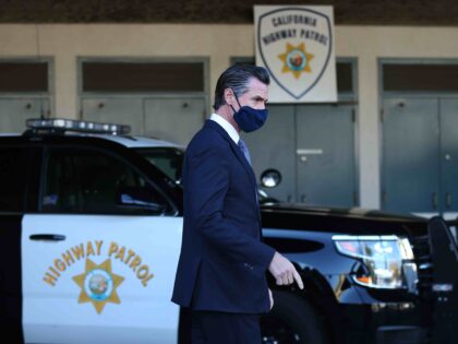 Newsom and California Highway Patrol (Ray Chavez/MediaNews Group/The Mercury News via Getty)