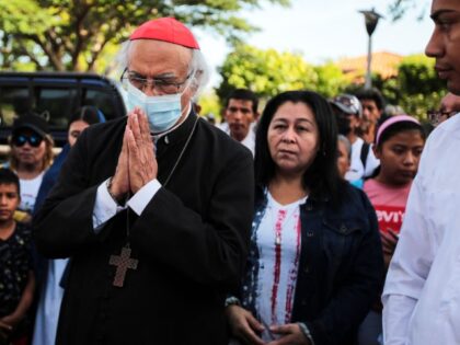 Nicaraguan Cardinal Leopoldo Brenes prays during a procession on Good Friday in the Holy Week celebrations around the fields at the Metropolitan Cathedral in Managua on April 7, 2023. - Catholic parishioners from Nicaragua celebrated the traditional Stations of the Cross on Friday in the temple grounds and in the …