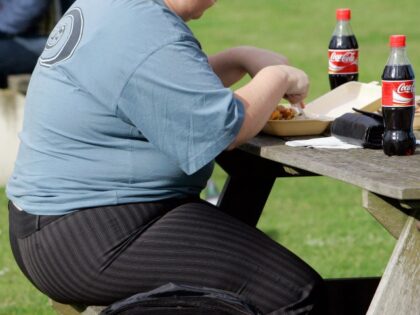 FILE - A person eats in London on Oct. 17, 2007. The World Health Organization says the number of heavy people in Europe has hit “epidemic proportions,” with nearly 60% of adults and one third of children weighing in as either overweight or obese. In a report issued on Tuesday, …