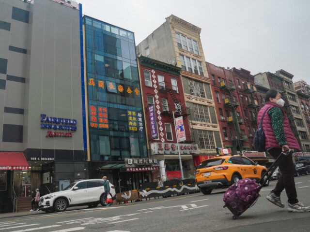 A six story glass facade building, second from left, is believed to be the site of a foreign police outpost for China in New York's Chinatown, Monday April 17, 2023. Justice Department officials say two men have been arrested on charges that they helped establish a secret police outpost in …