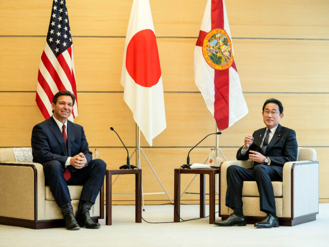 Florida Gov. Ron DeSantis, left, talks with Japanese Prime Minister Fumio Kishida as he pa