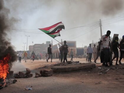 Sudanese demonstrators march in Khartoum, Sudan, Monday, Dec. 19, 2022 to protest a deal s
