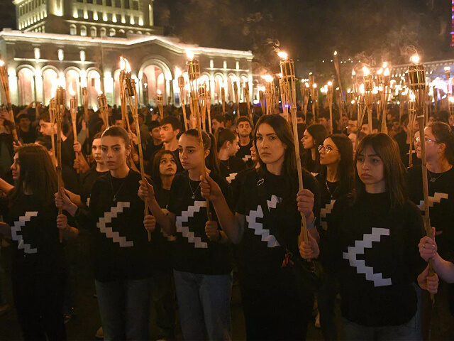 Armenians take part in a torchlight procession in Yerevan, late on April 23, 2023, to mark