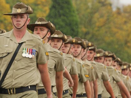 MELBOURNE, AUSTRALIA - APRIL 25: Members of the Australian Army march as they take part in the Anzac Day March past the Shrine of Remembrance on ANZAC Day on April 25, 2015 in Melbourne, Australia. Australians are celebrating the centenary of the Australian and New Zealand Army Corp (ANZAC) landing …