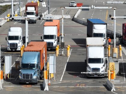 OAKLAND, CALIFORNIA - MARCH 31: In an aerial view, trucks line up to leave a shipping terminal at the Port of Oakland on March 31, 2023 in Oakland, California. The U.S. Environmental Protection Agency (EPA) announced that it will allow California's plan to phase out a variety of diesel-powered trucks …