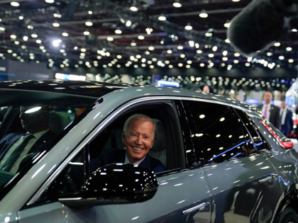 EVs - President Joe Biden drives a Cadillac Lyriq through the showroom during a tour at th