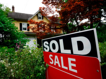 A sale sign stands outside a home in Wyndmoor, Pa., Wednesday, June 22, 2022. On Friday, the National Association of Realtors reports on sales of existing homes in December. (AP Photo/Matt Rourke, File)