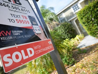 FILE - A real estate sign stands outside of a recently sold home on Feb. 21, 2023, in Valr