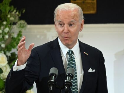 US President Joe Biden gestures as he speaks during a Banquet Dinner at Dublin Castle on A