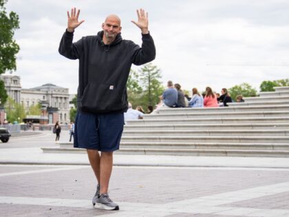 Sen. John Fetterman (D-PA) waves to reporters as he arrives at the U.S. Capitol on April 17, 2023 in Washington, DC. Fetterman is returning to the Senate following six weeks of treatment for clinical depression. (Photo by Drew Angerer/Getty Images)