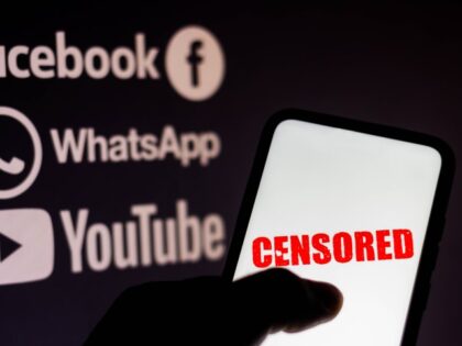 BRAZIL - 2021/08/23: In this photo illustration the word censored is seen displayed on a smartphone with the logos of social networks Facebook, WhatsApp and YouTube in the background. (Rafael Henrique/SOPA Images/LightRocket via Getty Images)