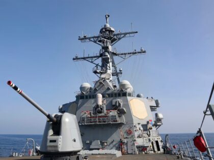 A U.S. Navy warship sailed through the waters separating Taiwan and mainland China on Sunday just days after Beijing concluded week-long war games around the self-ruled, independent island.