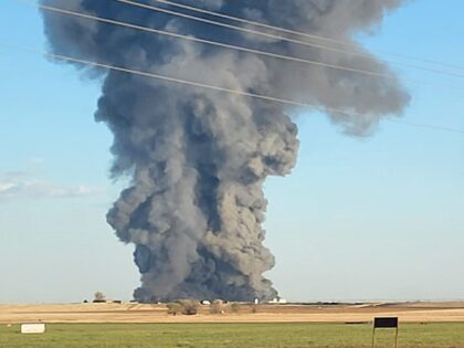 Smoke is visible a day after a massive explosion at a Texas dairy farm that left one perso