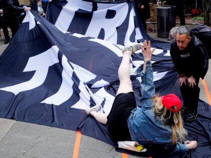 A supporter of former US president Donald Trump argues with opponents outside the Manhattan District Attorney's office in New York City on April 4, 2023. - Donald Trump will make an unprecedented appearance before a New York judge on April 4, 2023 to answer criminal charges that threaten to throw …