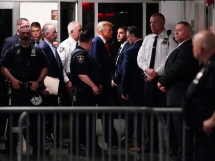 Former President Donald Trump is escorted to a courtroom, Tuesday, April 4, 2023, in New Y