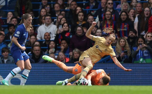 Chelsea goalkeeper Ann-Katrin Berger saves from Barcelona's Norwegian forward Caroline Gra