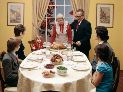 970s THREE GENERATION FAMILY HAVING THANKSGIVING DINNER (Photo by H. Armstrong Roberts/ClassicStock/Getty Images)