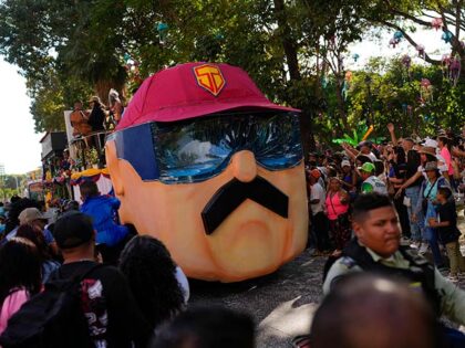 A carnival float depicting Super Mustache, or "Super Bigote" in Spanish, a character based on President Nicolas Maduro, parades during carnival celebrations in Caracas, Venezuela, Monday Feb. 20, 2023. (AP Photo/Ariana Cubillos)