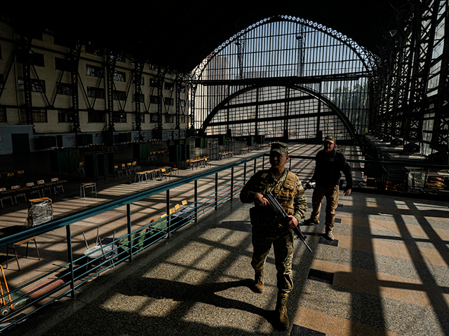 Soldiers guard the old Mapocho train station, now a cultural center, that will be used as