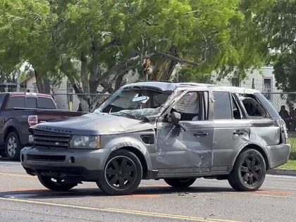 A damaged vehicle sits at the site of a deadly collision near a bus stop in Brownsville, Texas, on Sunday, May 7, 2023. (Brian Svendsen/NewsNation/KVEO-TV via AP)