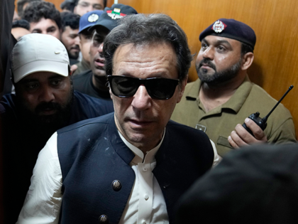Former Pakistani Prime Minister Imran Khan, center, leaves after appearing in a court, in