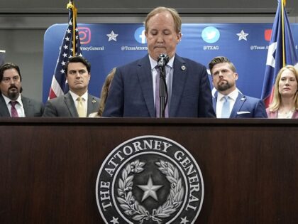 Texas state Attorney General Ken Paxton, center, flanked by his staff, makes a statement at his office in Austin, Texas, Friday, May 26, 2023. An investigating committee says the Texas House of Representatives will vote Saturday on whether to impeach state Attorney General Ken Paxton. (AP Photo/Eric Gay)