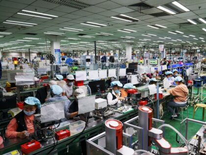 ZHONGMU, CHINA - SEPTEMBER 04: Employee work at a Foxconn factory on September 4, 2021 in Zhongmu County, Zhengzhou City, Henan Province of China. (Photo by VCG/VCG via Getty Images)