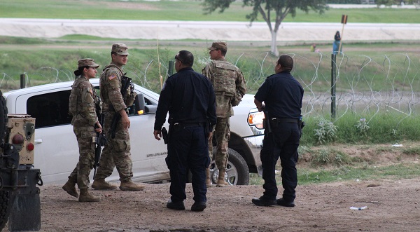 CBP OFO officers meet with Texas National Guard soldiers in Eagle Pass near the end of Title 42. (Randy Clark/Breitbart Texas)
