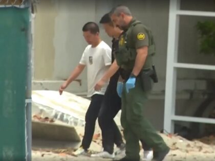 Border Patrol agents arrest a group of Chinese migrants on a Miami beach. (CBS10 Video Screenshot)