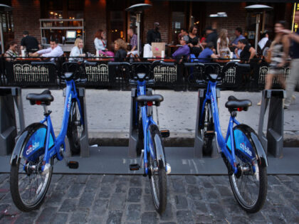 A Citi Bike docking station in a restaurant area of Chelsea, Manhattan, New York. Citi Bik