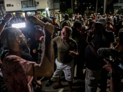 Demonstrators and government officials argue during a protest calling for the restoration of electrical service after six days of blackouts due to the devastation of Hurricane Ian in Havana, Cuba, Saturday, Oct 1, 2022.