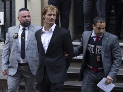 Daniel Penny, center, is walked by New York Police Department detectives out of the 5th Precinct on Friday, May 12, 2023, in New York. Manhattan prosecutors announced Thursday they would bring the criminal charge against Penny, 24, a U.S. Marine Corps veteran, in the May 1 death of 30-year-old Jordan …