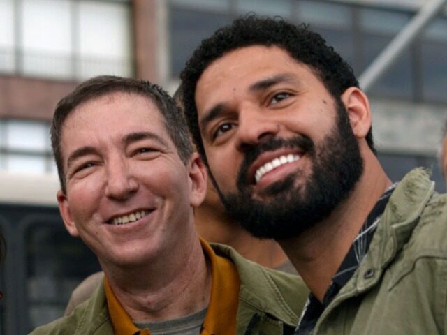 US journalist and author Glenn Greenwald (C) and his partner Brazilian congressman David M