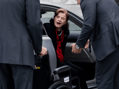 Sen. Dianne Feinstein, D-Calif., is assisted to a wheelchair by staff as she returns to the Senate after a more than two-month absence, at the Capitol in Washington, Wednesday, May 10, 2023.