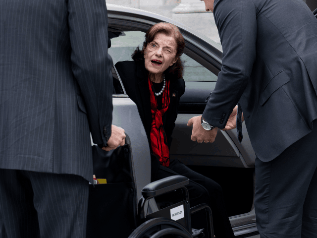 Sen. Dianne Feinstein, D-Calif., is assisted to a wheelchair by staff as she returns to th