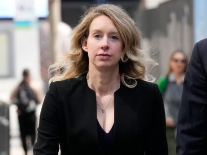 FILE - Former Theranos CEO Elizabeth Holmes leaves federal court in San Jose, Calif., March 17, 2023. On Monday, April 10, Holmes was rebuffed in her attempt to stay out of federal prison while she appeals her conviction for the fraud she committed while overseeing a blood-testing scam that exposed …
