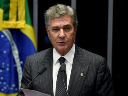 Brazilian Senator and former President (1990-1992) Fernando Collor de Mello delivers a speech during the debate on suspending and impeaching President Dilma Rousseff in Brasilia on May 11, 2016. A simple majority in the 81-member Senate will trigger Rousseff's six-month suspension pending trial. A two-thirds majority would then be needed …