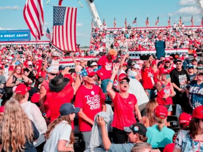 Attendees gather before a campaign rally with U.S. President Donald Trump in Sanford, Florida, U.S., on Monday, Oct. 12, 2020. Trump returns to the campaign trail today after declaring himself "in great shape" following his bout with coronavirus, with a rally near Orlando kicking off at least four straight days …