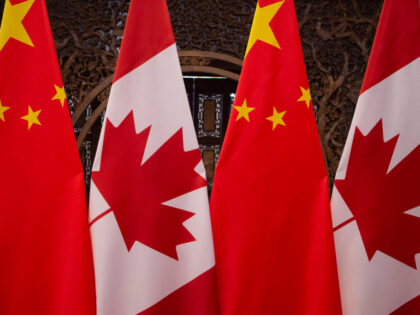 This picture taken on December 5, 2017, shows Canadian and Chinese flags taken prior to a meeting with Canada's Prime Minister Justin Trudeau and China's President Xi Jinping at the Diaoyutai State Guesthouse in Beijing. (Photo by Fred DUFOUR / POOL / AFP) (Photo by FRED DUFOUR/POOL/AFP via Getty Images)