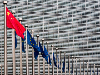 Chinas national flag, left, flies beside European Union (EU) flags outside the Berlaymont building during the EU-China summit in Brussels, Belgium, on Tuesday, April 9, 2019. The EU and China managed to agree on a joint statement for Tuesdays summit in Brussels, papering over divisions on trade in a bid …