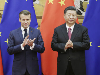 BEIJING, CHINA - NOVEMBER 6: Chinese President Xi Jinping and French President Emmanuel Macron stand in front of Chinese and EU flags at a signing ceremony inside the Great Hall of the People on November 6, 2019 in Beijing, China. Macron, who is on a three-day state visit and also …