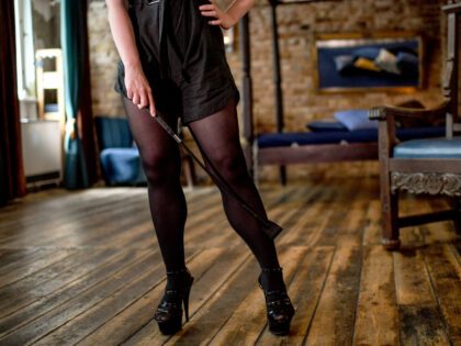 06 July 2020, Berlin: Dahlia Nyx, Bizarrlady stands in the wooden room in the Domina Bizarre Studio LUX. The dominatrix wants to draw attention to the work situation and consequences of corona-blocks for sex workers during a backstage tour in the dominatrix studio. +++Attention!!! For editorial use only !!! +++ …