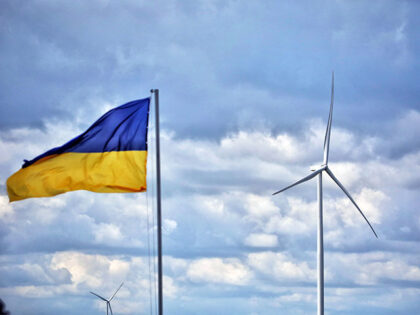 A Ukrainian flag flies next to a wind turbine during the launch of the first stage of the Dnistrovska Wind Farm with a capacity of 40 MW near Starokozache village, Odesa Region, western Ukraine. (Photo credit should read Nina Liashonok/ Ukrinform/Future Publishing via Getty Images)