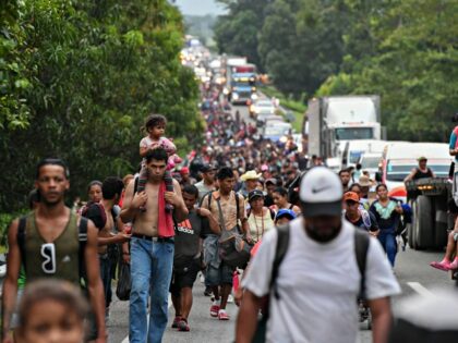 TOPSHOT - Migrants heading in a caravan to the US, walk towards Mexico City to request asy