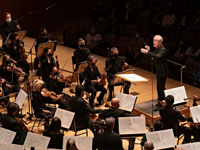 LOS ANGELES, CA - MARCH 24: David Robertson conducts the LA Philharmonic as they perform M
