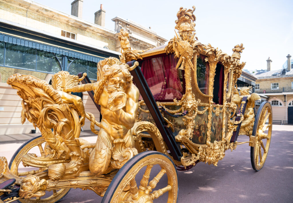 LONDON, ENGLAND - MAY 06: A general view of the Gold State Coach, at the Royal Mews, Buckingham Palace on May 6, 2022 in London, England. The coach will be used as part of Queen's Platinum Jubilee celebrations. (Photo by Dominic Lipinski - Pool / Getty Images)