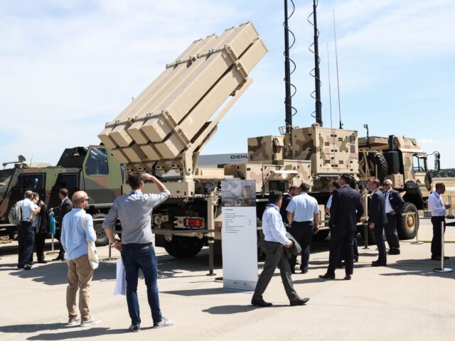 People view a displayed IRIS-T SLM air defense system at the ILA Berlin Air Show in Schoen
