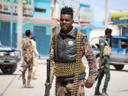 Security officers patrol near the destroyed Hayat Hotel after a deadly 30-hour siege by Al-Shabaab jihadists in Mogadishu on August 21, 2022. - At least 13 civilians lost their lives and dozens were wounded in the gun and bomb attack by the Al-Qaeda-linked group that began on Friday evening and …